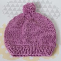child's pull on hat with pompom