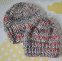 child's red and grey chunky hat