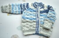 Handknitted round neck cardigan in blue, cream and grey